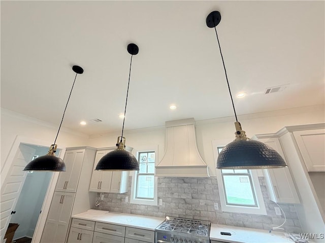 407 Edgefield Mews Cir, Tuscaloosa, AL 35406 - kitchen featuring custom range hood, range, tasteful backsplash, healthy amount of natural light, and ornamental molding