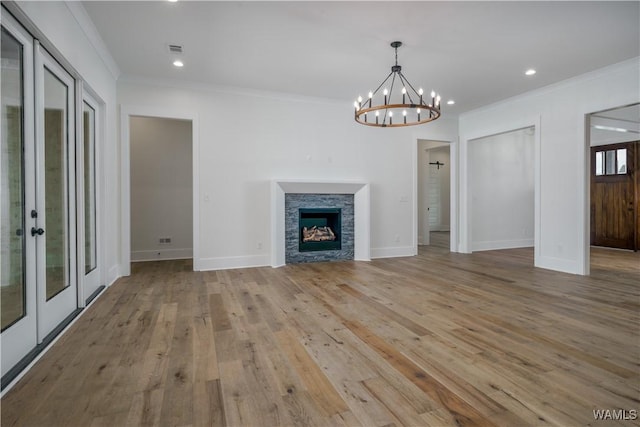 407 Edgefield Mews Cir, Tuscaloosa, AL 35406 - unfurnished living room with ornamental molding, french doors, light wood-type flooring, a chandelier, and recessed lighting