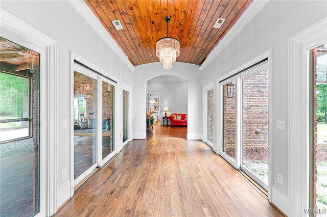 120 Magnolia Cir, Centreville, AL 35042 - corridor with hardwood / wood-style flooring, lofted ceiling, a chandelier, wooden ceiling, and arched walkways