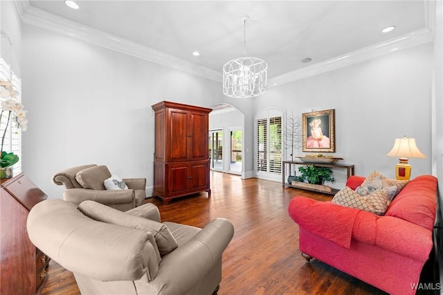 120 Magnolia Cir, Centreville, AL 35042 - living area with arched walkways, recessed lighting, wood finished floors, ornamental molding, and a chandelier