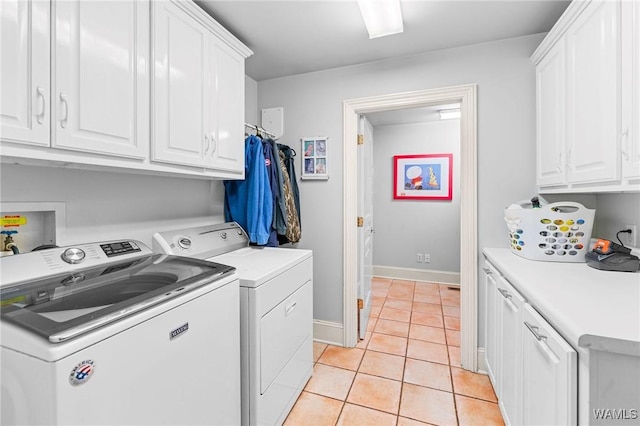 120 Magnolia Cir, Centreville, AL 35042 - laundry room with cabinet space, washing machine and dryer, and light tile patterned flooring