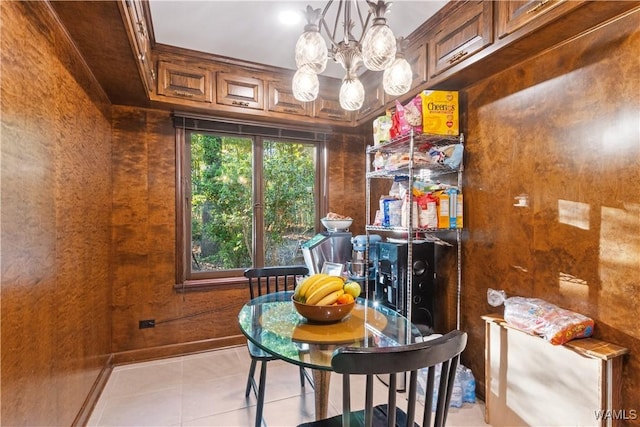 dining room with an inviting chandelier and light tile patterned flooring