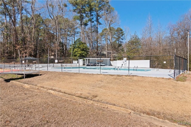 community pool featuring fence