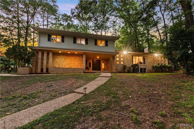 view of front of house with brick siding
