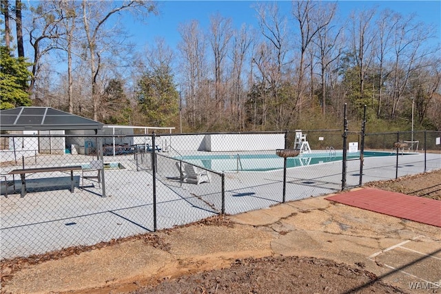 community pool featuring fence