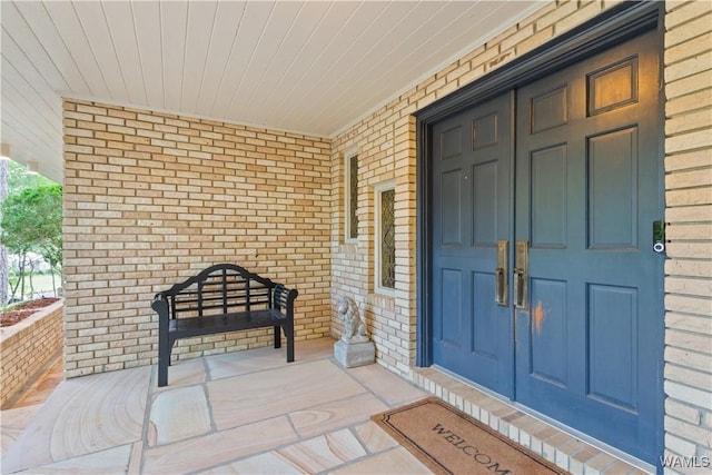 4704 Oneida Ave, Northport, AL 35473 - view of exterior entry with brick siding and covered porch