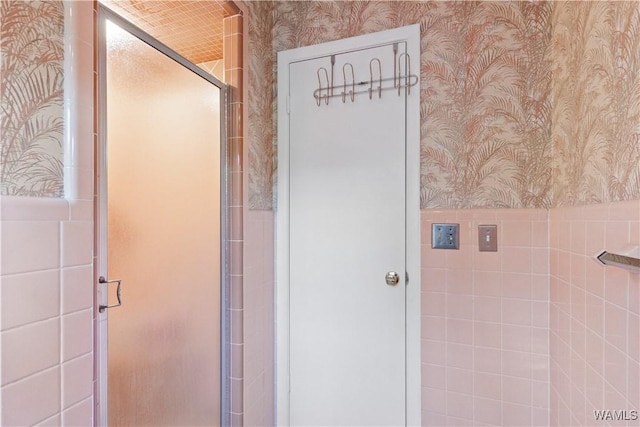 4704 Oneida Ave, Northport, AL 35473 - bathroom featuring wallpapered walls and a stall shower