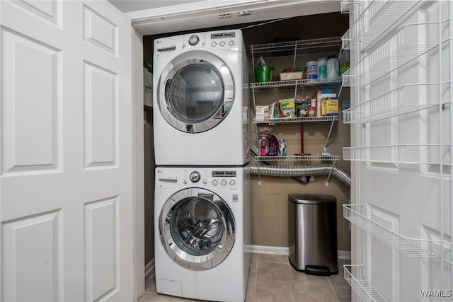 303 Helen Keller Blvd Unit B319, Tuscaloosa, AL 35404 - laundry room with estacked washer and dryer and tile patterned floors