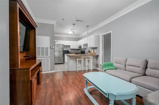 303 Helen Keller Blvd Unit B319, Tuscaloosa, AL 35404 - living area with wood finished floors and crown molding