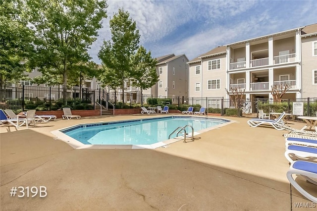 303 Helen Keller Blvd Unit B319, Tuscaloosa, AL 35404 - community pool featuring a patio area and a residential view