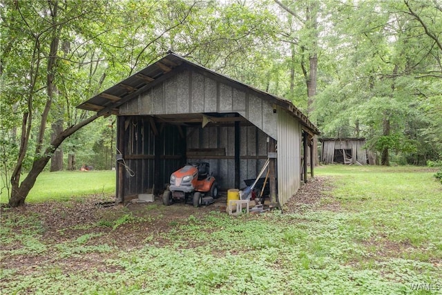221 3rd Ct SW, Fayette, AL 35555 - view of pole building featuring a lawn and a view of trees