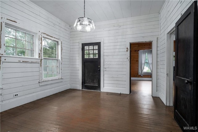 221 3rd Ct SW, Fayette, AL 35555 - foyer featuring wood-type flooring, wooden walls, and a chandelier