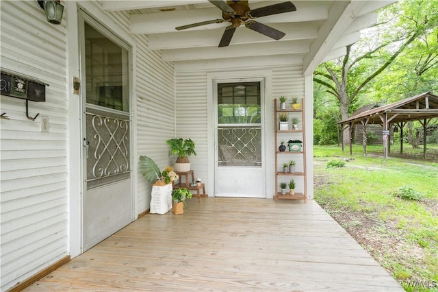 221 3rd Ct SW, Fayette, AL 35555 - wooden deck featuring ceiling fan and a lawn