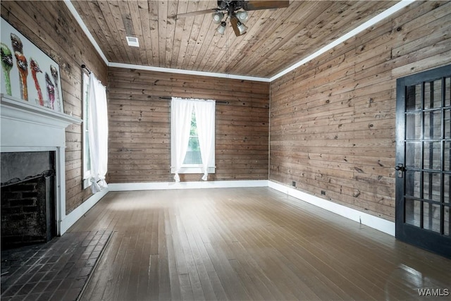 221 3rd Ct SW, Fayette, AL 35555 - unfurnished living room featuring ceiling fan, wooden walls, wooden ceiling, dark wood-style floors, and a fireplace