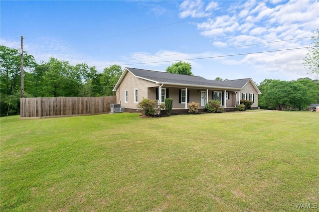 single story home with central air condition unit, a front lawn, fence, and covered porch