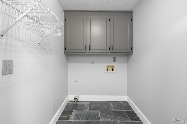 clothes washing area featuring hookup for a gas dryer, hookup for a washing machine, baseboards, and hookup for an electric dryer