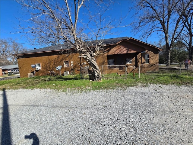 view of front of house featuring fence