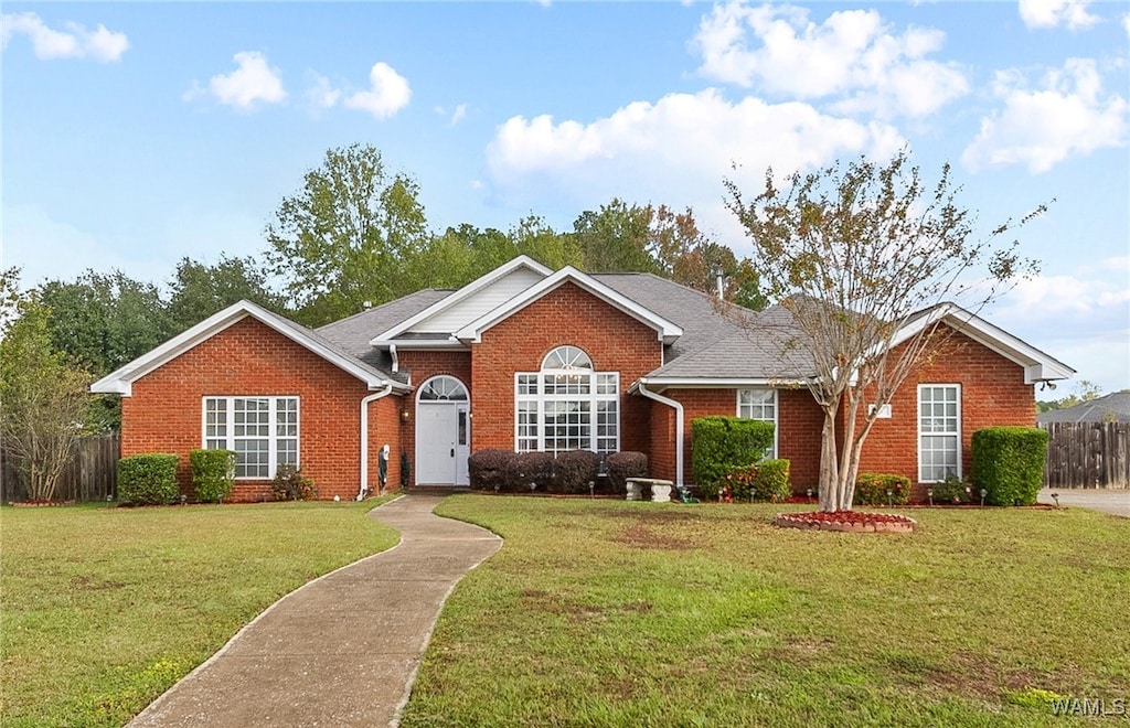 ranch-style home with a front yard