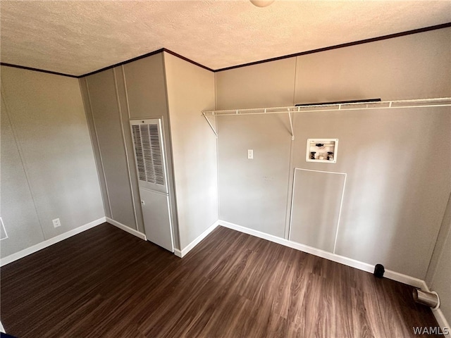 laundry area featuring washer hookup, crown molding, dark wood-type flooring, and a textured ceiling