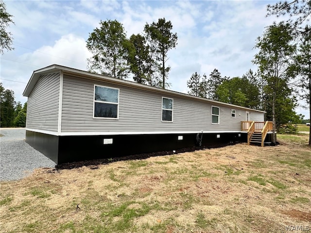 back of house featuring a deck