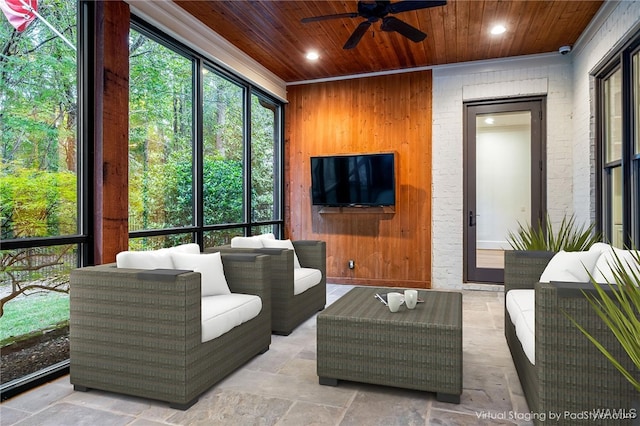 sunroom / solarium with ceiling fan and wood ceiling