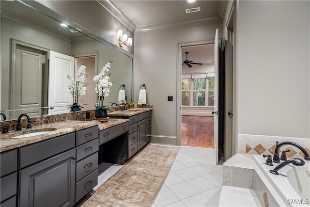 bathroom with vanity, tile patterned floors, ceiling fan, a relaxing tiled tub, and ornamental molding