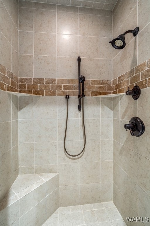 bathroom with a tile shower