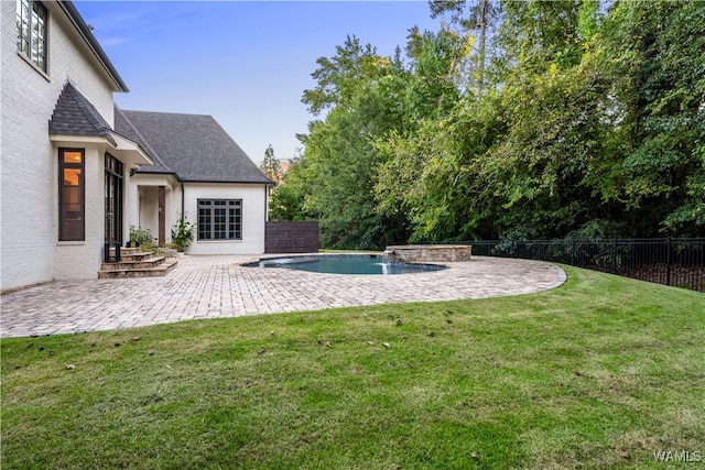 view of yard with a fenced in pool and a patio area