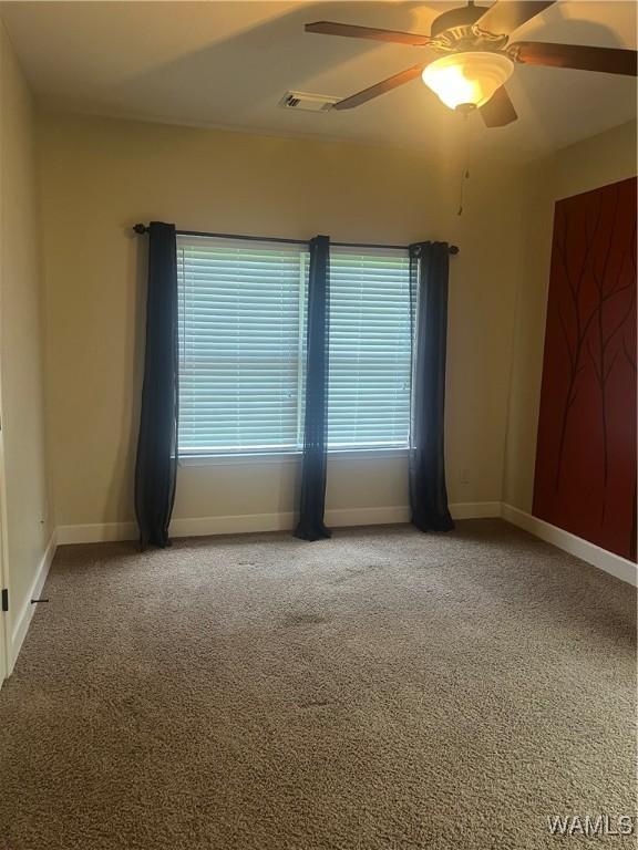 11408 Belle Meade Way, Northport, AL 35475 - carpeted empty room featuring ceiling fan, baseboards, and plenty of natural light