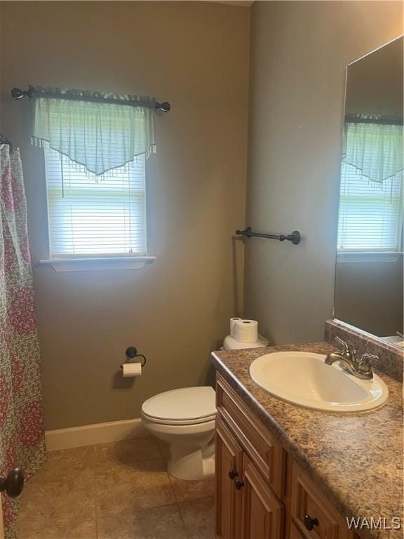 11408 Belle Meade Way, Northport, AL 35475 - bathroom with tile patterned flooring, vanity, toilet, and baseboards