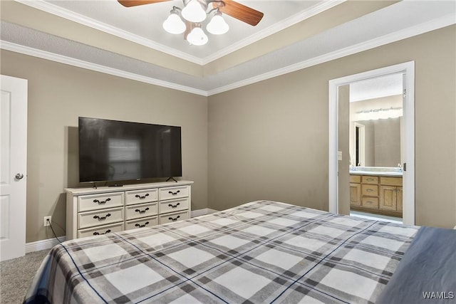 bedroom featuring baseboards, ceiling fan, ornamental molding, carpet flooring, and ensuite bath