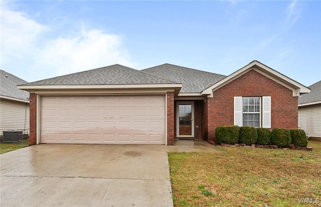 single story home with brick siding, concrete driveway, roof with shingles, a front yard, and a garage