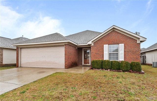 single story home featuring driveway, a front yard, a shingled roof, a garage, and brick siding