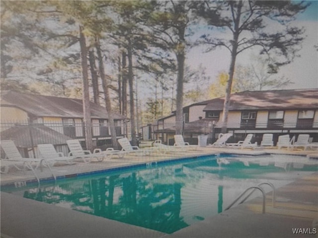 community pool with a patio