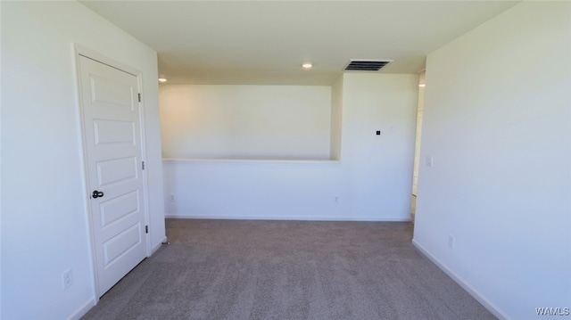 empty room featuring dark colored carpet