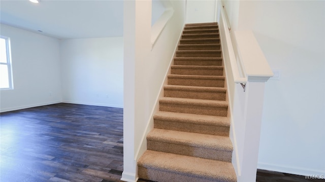 stairs with hardwood / wood-style floors