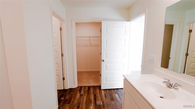 bathroom with vanity and hardwood / wood-style flooring