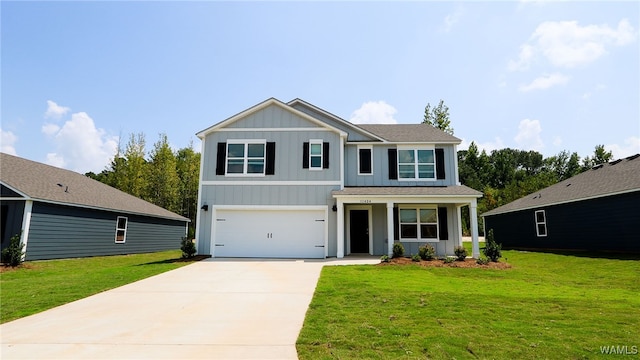 view of front of property featuring a garage and a front lawn