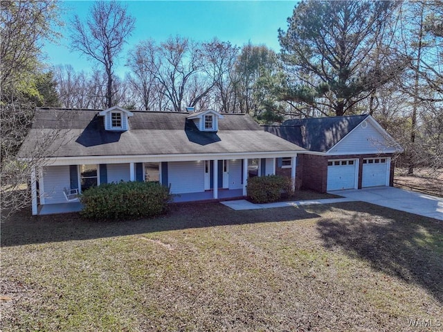 view of front facade featuring a porch, a garage, and a front lawn