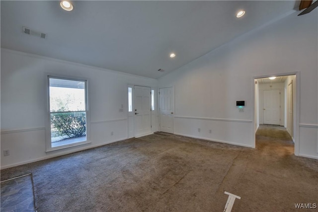 carpeted empty room featuring ceiling fan and lofted ceiling