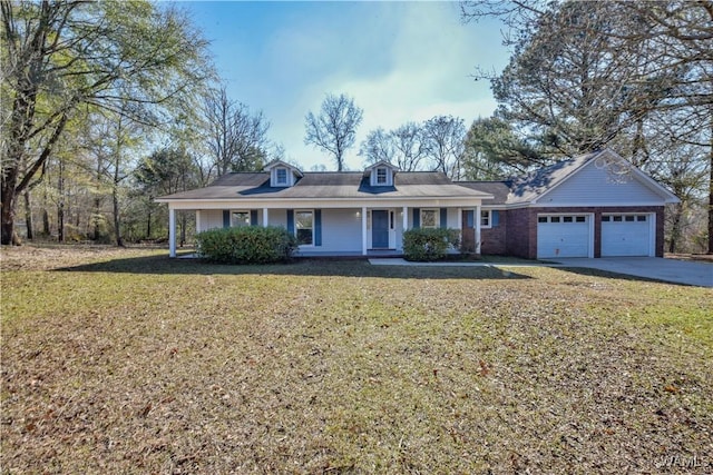 ranch-style house featuring a front yard, a porch, and a garage