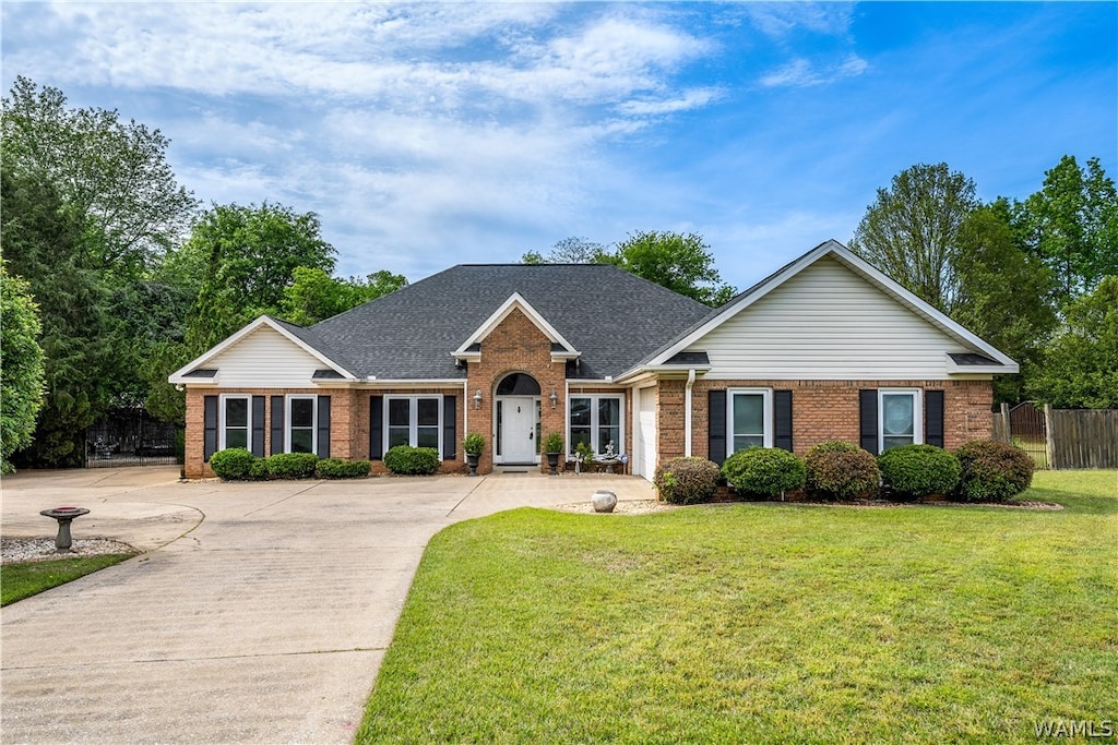 ranch-style home with a front lawn