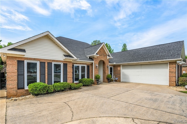 single story home featuring a garage