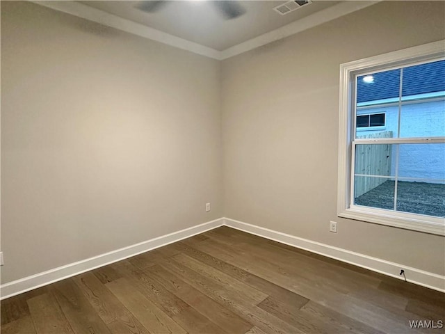 unfurnished room featuring dark hardwood / wood-style flooring and ornamental molding