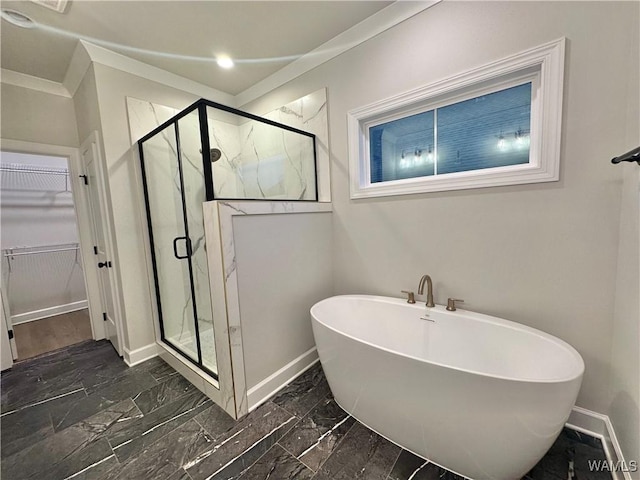 bathroom with crown molding and shower with separate bathtub