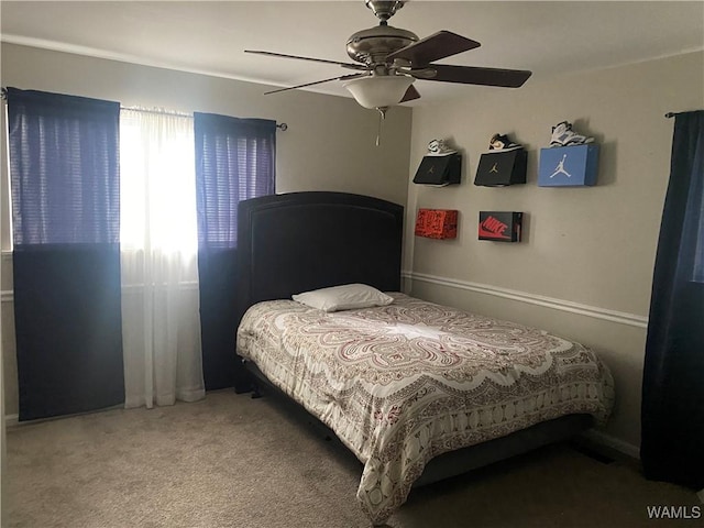 bedroom with ceiling fan and carpet floors