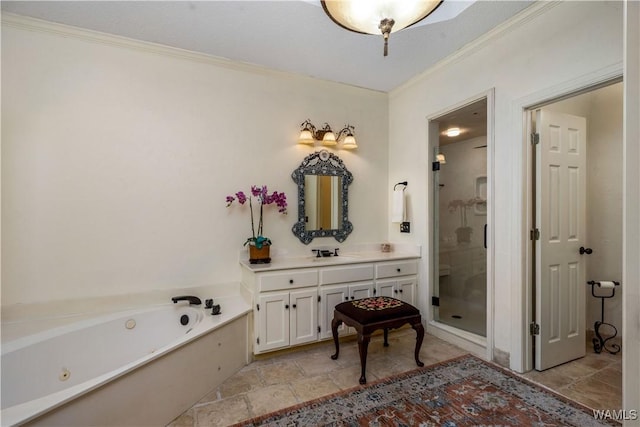 full bathroom featuring stone tile floors, a jetted tub, a shower stall, crown molding, and vanity