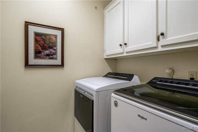 laundry room featuring cabinet space and independent washer and dryer