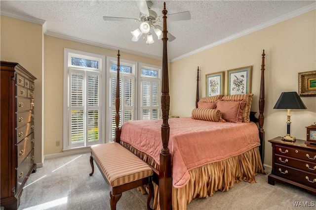 bedroom featuring a textured ceiling, ornamental molding, and light carpet