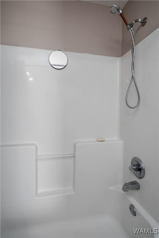 interior details with shower / tub combination